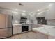 Kitchen with stainless steel appliances, gray cabinets, marbled countertops, and modern backsplash tiles at 9555 E Raintree Dr # 1055, Scottsdale, AZ 85260