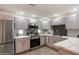Updated kitchen featuring stainless steel appliances, tile backsplash, and painted cabinets at 9555 E Raintree Dr # 1055, Scottsdale, AZ 85260