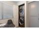 Conveniently placed stacked washer and dryer with built-in storage at 9555 E Raintree Dr # 1055, Scottsdale, AZ 85260