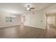 Inviting living room featuring wood-look floors, ceiling fan, and neutral paint at 9555 E Raintree Dr # 1055, Scottsdale, AZ 85260