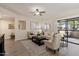 Comfortable living room with neutral tones and sliding glass doors to outdoor area at 9555 E Raintree Dr # 1055, Scottsdale, AZ 85260