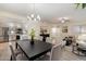 Open-concept layout with dining area leading to a bright living room and modern kitchen at 9555 E Raintree Dr # 1055, Scottsdale, AZ 85260