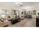 Sunlit living room and dining area with modern furnishings and sliding glass door at 9555 E Raintree Dr # 1055, Scottsdale, AZ 85260