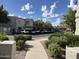 Well-maintained parking area with lush landscaping and convenient access to the building at 9555 E Raintree Dr # 1055, Scottsdale, AZ 85260