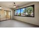 Enclosed patio with large picture window overlooking landscaped street at 9555 E Raintree Dr # 1055, Scottsdale, AZ 85260