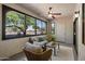 Cozy sun room with natural light, ceiling fan, and comfortable seating at 9555 E Raintree Dr # 1055, Scottsdale, AZ 85260