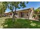 Inviting backyard patio with desert landscaping, offering a relaxing outdoor living space at 9649 E Holiday Way, Sun Lakes, AZ 85248