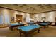 Well-lit billiard room featuring multiple tables with blue felt and coffered ceilings at 9649 E Holiday Way, Sun Lakes, AZ 85248