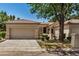 Charming single-story home features a well-manicured lawn and a two-car garage at 9649 E Holiday Way, Sun Lakes, AZ 85248