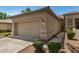 This home has a well-maintained lawn and a convenient two-car garage at 9649 E Holiday Way, Sun Lakes, AZ 85248