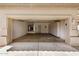 Spacious two-car garage with storage cabinets and utility connections, ready for use at 9649 E Holiday Way, Sun Lakes, AZ 85248