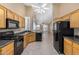 Kitchen featuring black appliances, ample cabinet space, and an eat-in area at 9649 E Holiday Way, Sun Lakes, AZ 85248