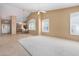 Open concept living area features neutral decor, tiled floor, and natural light at 9649 E Holiday Way, Sun Lakes, AZ 85248