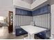 Inviting breakfast nook features built-in seating and storage with a trendy patterned backsplash and a white tabletop at 9736 E Ironwood Dr, Scottsdale, AZ 85258