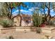 Scottsdale Ranch community entrance featuring lush desert landscaping and rock signage at 9736 E Ironwood Dr, Scottsdale, AZ 85258