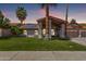 Charming single-story home with a well-manicured lawn and desert landscaping at 9736 E Ironwood Dr, Scottsdale, AZ 85258