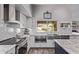 Well-equipped kitchen with stainless steel appliances and stylish backsplash at 9736 E Ironwood Dr, Scottsdale, AZ 85258