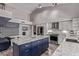 Stylish kitchen with a large island, stainless steel appliances, and a breakfast nook at 9736 E Ironwood Dr, Scottsdale, AZ 85258