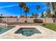 Relax in the inground spa surrounded by mature trees and lush landscaping in your private backyard at 9736 E Ironwood Dr, Scottsdale, AZ 85258