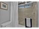 Clean bathroom with tiled shower, white shower curtain, and updated fixtures at 10743 W Frier Dr, Glendale, AZ 85307