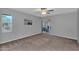 Cozy bedroom with carpeted floors, ceiling fan, and access to a patio at 10743 W Frier Dr, Glendale, AZ 85307