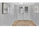 The entrance features a double door and beautiful flooring that leads into the home at 10743 W Frier Dr, Glendale, AZ 85307