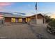 Exterior of home with desert landscaping, American flag, and covered front entry at 10743 W Frier Dr, Glendale, AZ 85307