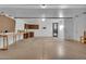 Spacious garage with ample storage, workbench area, pegboard, and shelving at 10743 W Frier Dr, Glendale, AZ 85307
