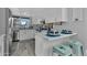 Bright, modern kitchen with white cabinets, stainless steel appliances, and breakfast bar at 10743 W Frier Dr, Glendale, AZ 85307