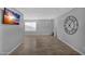 Contemporary living room design with large windows and stylish laminate flooring at 10743 W Frier Dr, Glendale, AZ 85307