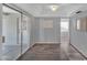 Open living room with sliding glass doors and tile entry at 10743 W Frier Dr, Glendale, AZ 85307