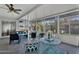Bright and airy sunroom perfect for relaxation, featuring comfortable seating and natural light at 10743 W Frier Dr, Glendale, AZ 85307