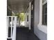 Covered porch with white railings and a secure entry door at 11411 N 91St Ave # 75, Peoria, AZ 85345