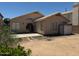 Spacious backyard with covered patio, large yard, and block wall fence at 1612 E Barbarita Ave, Gilbert, AZ 85234
