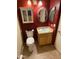 Cozy bathroom with a vanity, toilet, mirror, and cabinet at 1612 E Barbarita Ave, Gilbert, AZ 85234