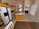 Cozy kitchen featuring an island and tile flooring, seamlessly connected to the living area at 1612 E Barbarita Ave, Gilbert, AZ 85234