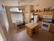 Functional kitchen with an island, tile flooring, and eat-in dining area at 1612 E Barbarita Ave, Gilbert, AZ 85234
