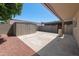 Backyard featuring a storage shed, covered patio, and low-maintenance landscaping at 1744 E Huber St, Mesa, AZ 85203