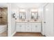 Modern bathroom featuring double vanities, stylish mirrors, and walk in shower at 1744 E Huber St, Mesa, AZ 85203