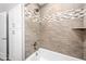 Beautiful bathroom showcasing tiled shower-tub with built-in storage at 1744 E Huber St, Mesa, AZ 85203