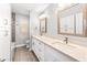 Bathroom features a double sink vanity and tiled shower-tub at 1744 E Huber St, Mesa, AZ 85203