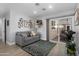Cozy bedroom with a sitting area, opening to the backyard, and a tranquil decor at 1744 E Huber St, Mesa, AZ 85203
