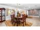 Spacious dining room with decorative chandelier, stylish furnishings, and plenty of natural light at 1744 E Huber St, Mesa, AZ 85203