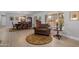 Welcoming dining area with elegant chandelier, wood furniture, and natural light at 1744 E Huber St, Mesa, AZ 85203