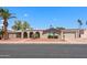 Charming single-story home featuring a well-manicured front yard and an attached two-car garage at 1744 E Huber St, Mesa, AZ 85203