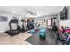 Home gym with treadmill, elliptical, free weights, and TV at 1744 E Huber St, Mesa, AZ 85203