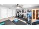 Bright home gym featuring a treadmill, elliptical, and sauna at 1744 E Huber St, Mesa, AZ 85203