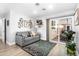 Cozy living room with comfortable seating, stylish rug, and plenty of natural light at 1744 E Huber St, Mesa, AZ 85203