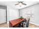 Spacious home office with windows, desk, and storage at 1744 E Huber St, Mesa, AZ 85203