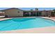 Backyard swimming pool with covered patio area and room for seating at 1744 E Huber St, Mesa, AZ 85203